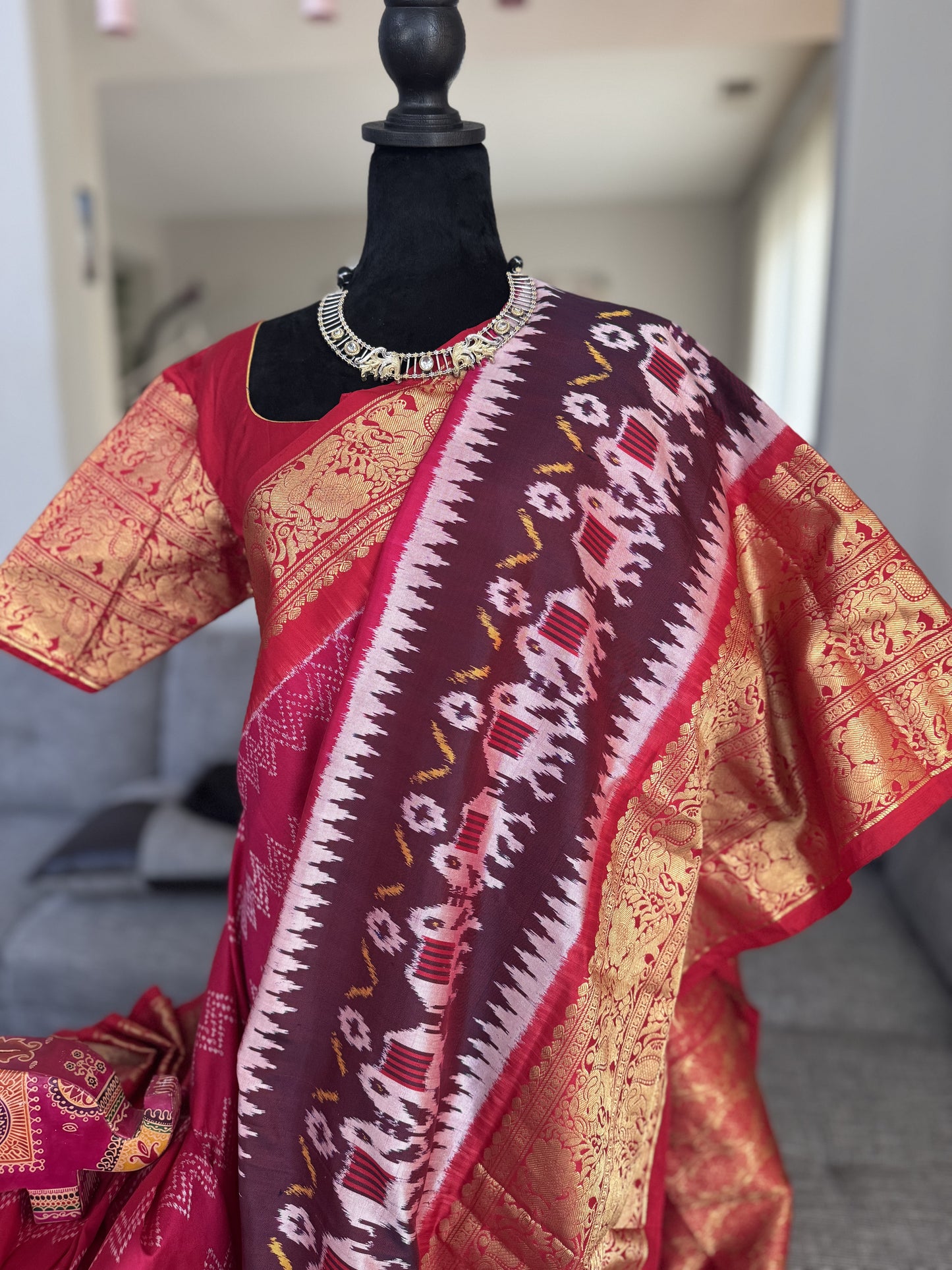 Pink ikkath Patola with Red Kanchi Border.