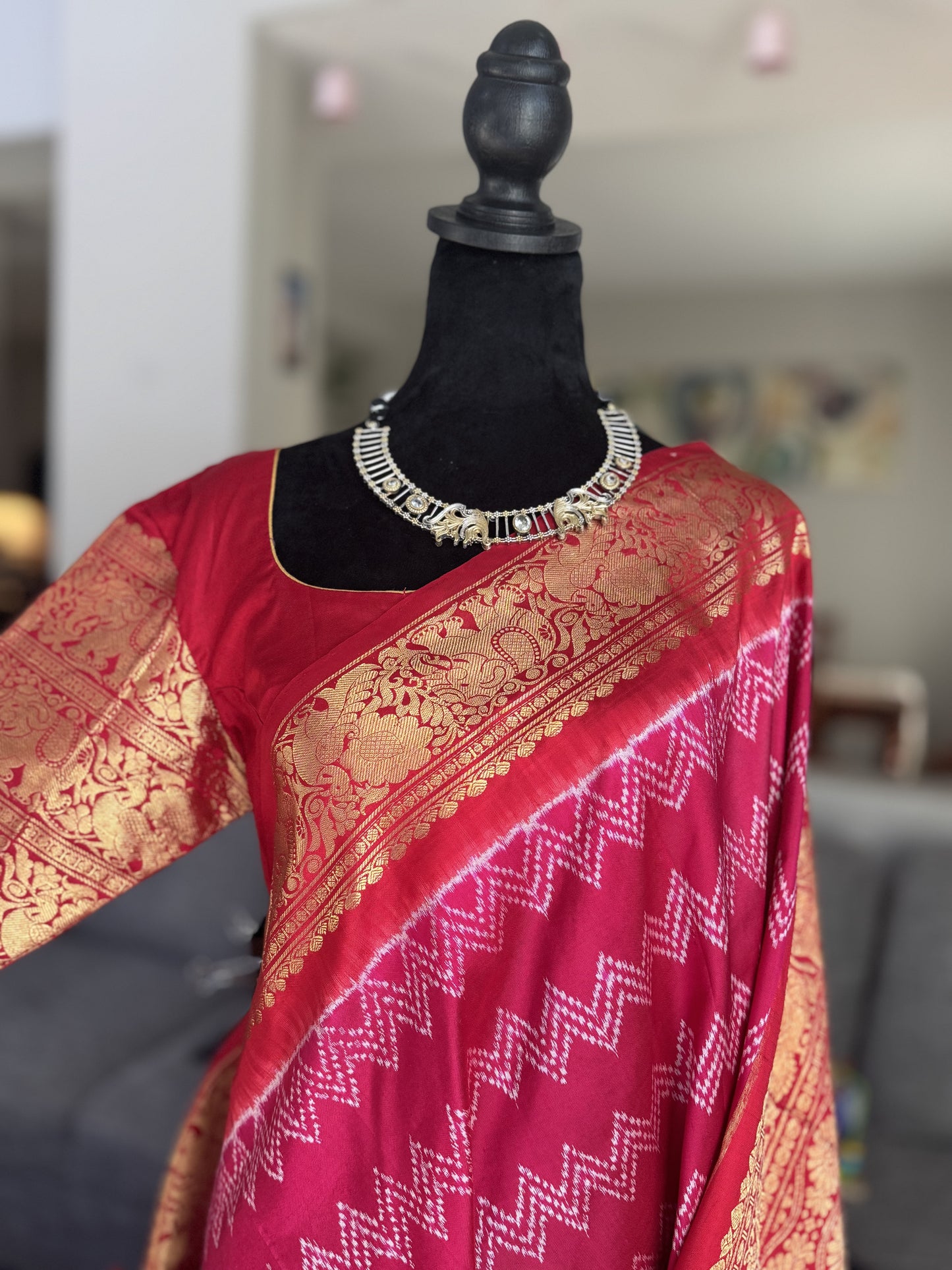 Pink ikkath Patola with Red Kanchi Border.